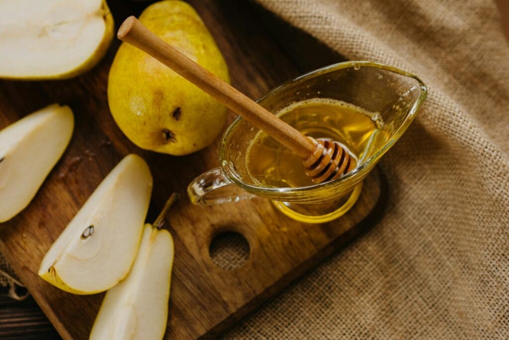 Honey with Pears on Cutting Board